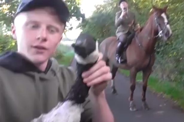 The boy - who was wearing a hunt steward top - pretended to try and make the dead animal talk