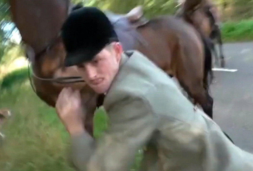 The hunter jumps off his horse to confront protester before scuffling with him