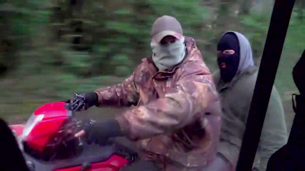 Masked pro-hunt gang on quad bikes chase protesters trying to protect foxes