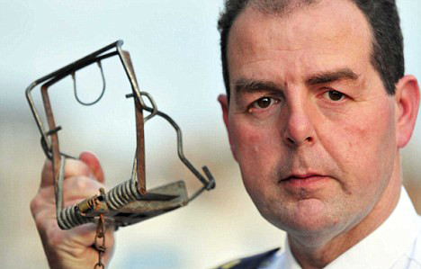 RSPCA inspector Ken Snook with the rat trap that killed Blue